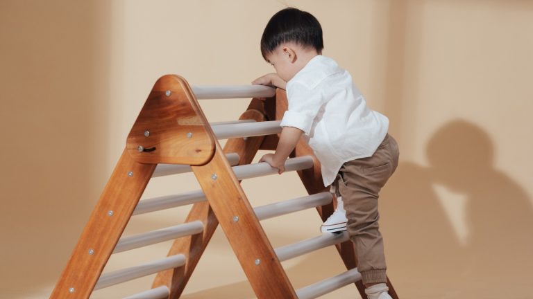 a child climbing a ladder