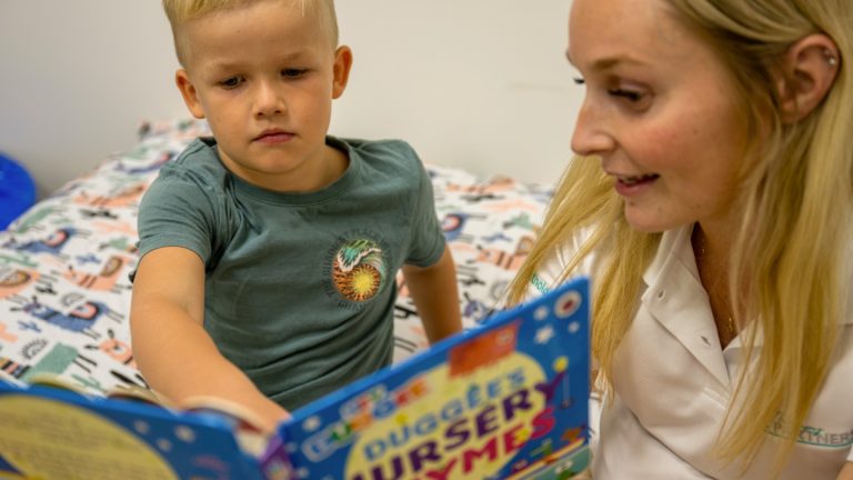 a child in a speech pathology session