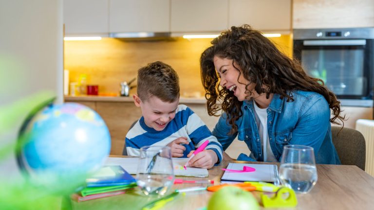 child with positive behaviour completing a task