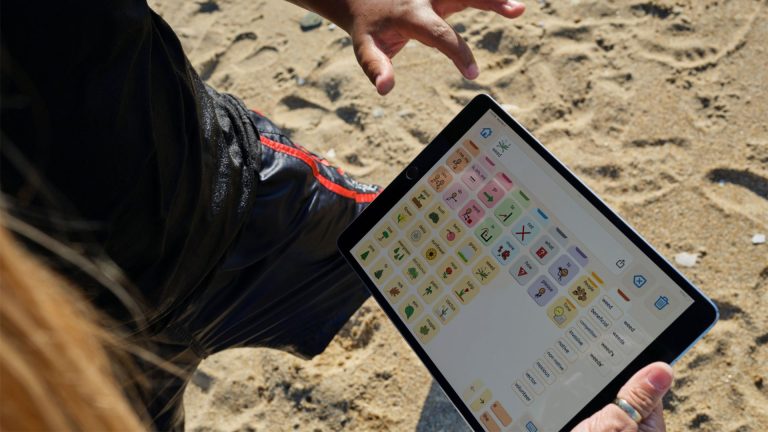 kids using ACC device at the beach